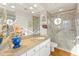 Bathroom vanity with granite counters and walk-in shower at 7525 E Gainey Ranch Rd # 164, Scottsdale, AZ 85258
