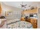 Bedroom with vaulted ceiling, wood floors, and office space at 7525 E Gainey Ranch Rd # 164, Scottsdale, AZ 85258