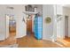 Bright entryway featuring hardwood floors, high ceilings, and decorative furniture and interior design at 7525 E Gainey Ranch Rd # 164, Scottsdale, AZ 85258