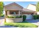 Charming single-story home featuring a front yard with manicured landscaping and a two-car garage at 7525 E Gainey Ranch Rd # 164, Scottsdale, AZ 85258