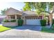 Charming single-story home featuring a front yard with manicured landscaping and a two-car garage at 7525 E Gainey Ranch Rd # 164, Scottsdale, AZ 85258