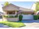 Charming single-story home featuring a front yard with manicured landscaping and a two-car garage at 7525 E Gainey Ranch Rd # 164, Scottsdale, AZ 85258