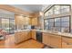 Eat-in kitchen with granite countertops, light wood cabinetry, and stainless steel appliances at 7525 E Gainey Ranch Rd # 164, Scottsdale, AZ 85258
