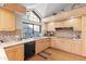 Eat-in kitchen with granite countertops, light wood cabinetry, and stainless steel appliances at 7525 E Gainey Ranch Rd # 164, Scottsdale, AZ 85258