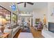 Spacious living room with tall ceilings, oversized windows, and hardwood floors at 7525 E Gainey Ranch Rd # 164, Scottsdale, AZ 85258