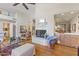 Open floor plan with hardwood floors, wet bar, and fireplace at 7525 E Gainey Ranch Rd # 164, Scottsdale, AZ 85258