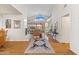 Open-concept living space with hardwood floors, fireplace, and large windows for natural light at 7525 E Gainey Ranch Rd # 164, Scottsdale, AZ 85258