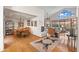 Open-concept living space with hardwood floors, fireplace, formal dining, and large windows for natural light at 7525 E Gainey Ranch Rd # 164, Scottsdale, AZ 85258