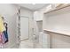Organized walk-in closet with built in shelves and drawers at 7525 E Gainey Ranch Rd # 164, Scottsdale, AZ 85258