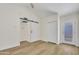 Bedroom with vaulted ceilings, modern floors, and barn door to bathroom at 7835 N 21St Dr, Phoenix, AZ 85021