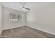 Bedroom with neutral walls, ceiling fan, and a bright window for natural light at 7835 N 21St Dr, Phoenix, AZ 85021