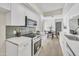 Bright kitchen boasts stainless appliances, tiled backsplash, and open dining area at 7835 N 21St Dr, Phoenix, AZ 85021