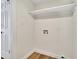 Laundry room with shelf and wood look flooring at 7835 N 21St Dr, Phoenix, AZ 85021