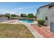 Community pool surrounded by lush landscaping and brick accents at 7835 N 21St Dr, Phoenix, AZ 85021