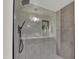 Modern shower has sleek tile, dual shower heads, and built-in shelf at 7835 N 21St Dr, Phoenix, AZ 85021