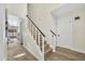 Elegant stairway with wood and white trim and luxury vinyl plank flooring on both levels at 7835 N 21St Dr, Phoenix, AZ 85021
