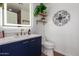 Contemporary bathroom with a unique mirror, stylish vanity and modern fixtures at 8155 E Columbus Ave, Scottsdale, AZ 85251
