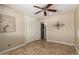 Bedroom featuring a ceiling fan, closet, and stylish tile flooring at 8155 E Columbus Ave, Scottsdale, AZ 85251