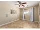 Bedroom featuring a ceiling fan, window with coverings, and stylish tile flooring at 8155 E Columbus Ave, Scottsdale, AZ 85251