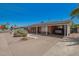 A single-story brick home featuring a covered carport and xeriscaped front yard at 8155 E Columbus Ave, Scottsdale, AZ 85251