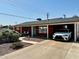 Charming single-story home featuring a covered carport, landscaped front yard, and classic brick facade at 8155 E Columbus Ave, Scottsdale, AZ 85251
