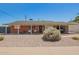 Charming brick home featuring a covered carport and a low-maintenance desert landscape at 8155 E Columbus Ave, Scottsdale, AZ 85251