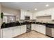 Modern kitchen features stainless steel appliances, granite counters, and a breakfast bar at 8155 E Columbus Ave, Scottsdale, AZ 85251