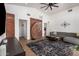 Bright living room with modern decor, brick accent wall, and light wood floors at 8155 E Columbus Ave, Scottsdale, AZ 85251