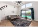 Cozy living room with a view of the pool, light wood floors, and modern furnishings at 8155 E Columbus Ave, Scottsdale, AZ 85251