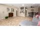 Open-concept living space with tile floors, a stylish breakfast bar, and modern decor at 8155 E Columbus Ave, Scottsdale, AZ 85251