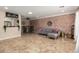 Open-concept living space with tile floors, a stylish breakfast bar, and modern decor at 8155 E Columbus Ave, Scottsdale, AZ 85251