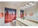 Bathroom boasts granite vanity, shower, a desert themed shower curtain, and decorative lighting at 8355 E Vía De Los Libros --, Scottsdale, AZ 85258