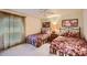 Comfortable bedroom featuring twin beds, neutral walls, and a ceiling fan at 8355 E Vía De Los Libros --, Scottsdale, AZ 85258