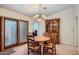 Inviting dining area featuring a wooden table, classic hutch, and sliding glass door at 8355 E Vía De Los Libros --, Scottsdale, AZ 85258