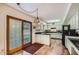 View of kitchen with wood cabinets and black countertops, as well as a door to the backyard at 8355 E Vía De Los Libros --, Scottsdale, AZ 85258