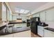 Bright kitchen with black appliances, black granite countertops, and plenty of cabinet space at 8355 E Vía De Los Libros --, Scottsdale, AZ 85258