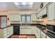 Functional kitchen with ample counter space, black appliances, and well-lit interiors at 8355 E Vía De Los Libros --, Scottsdale, AZ 85258