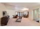 Cozy living room with plush carpeting, comfortable seating, and access to dining area at 8355 E Vía De Los Libros --, Scottsdale, AZ 85258