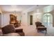 Open-concept living and dining area with carpet flooring and ample natural light at 8355 E Vía De Los Libros --, Scottsdale, AZ 85258