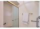 Shower with glass doors, built in bench, and grab bars at 8355 E Vía De Los Libros --, Scottsdale, AZ 85258