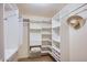 Spacious walk-in closet with built-in shelving and hanging rods at 8355 E Vía De Los Libros --, Scottsdale, AZ 85258