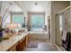 Bright bathroom with dual sinks, a separate shower, and tiled flooring at 9038 E Calle De Valle Dr, Scottsdale, AZ 85255