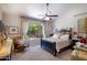 Bright bedroom boasts a large window, vaulted ceiling, and neutral tones at 9038 E Calle De Valle Dr, Scottsdale, AZ 85255