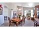 Bright dining room featuring a wooden table, decorative chairs, and charming decor at 9038 E Calle De Valle Dr, Scottsdale, AZ 85255