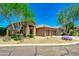 Charming single-story home featuring desert landscaping, a tile roof, and a three-car garage at 9038 E Calle De Valle Dr, Scottsdale, AZ 85255