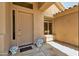 Charming front porch features a decorative door with stylish hardware and lovely accent decor at 9038 E Calle De Valle Dr, Scottsdale, AZ 85255