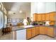 Open kitchen area showcasing cabinetry, granite counters, and seamless flow to living space at 9038 E Calle De Valle Dr, Scottsdale, AZ 85255
