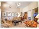 Inviting living room with ample seating, stylish decor, and natural light at 9038 E Calle De Valle Dr, Scottsdale, AZ 85255