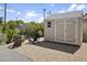 Inviting backyard featuring a shed and a cozy fire pit area, perfect for outdoor relaxation at 912 E Orchid Ln, Phoenix, AZ 85020