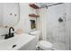 Stylish bathroom featuring marbled shower walls, floating shelves, modern fixtures, and mosaic flooring at 912 E Orchid Ln, Phoenix, AZ 85020